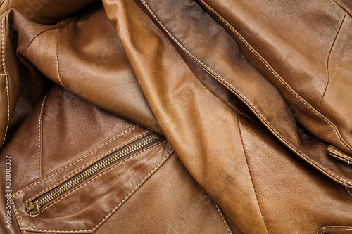 Detail of light brown leather clothing © kocetoiliev