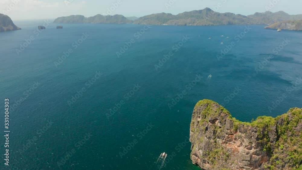 aerial view of Seascape with tropical rocky islands, blue water. islands and mountains covered with tropical forest. El nido, Philippines, Palawan aerial view of Seascape with tropical rocky islands, blue water. islands and mountains covered with tropical forest. El nido, Philippines, Palawan