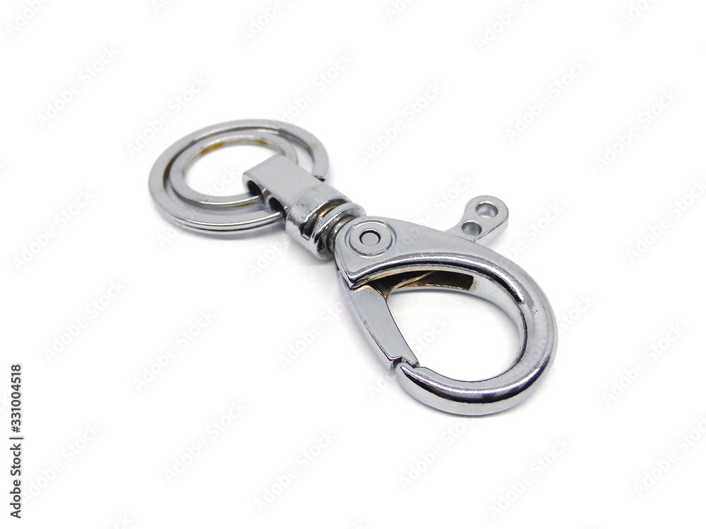 Close up of key chain or key ring isolated on white background. Alloy keychain. Chrome color keyring. Close up of key chain or key ring isolated on white background. Alloy keychain. Chrome color keyring.