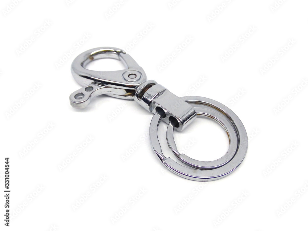 Close up of key chain or key ring isolated on white background. Alloy keychain. Chrome color keyring. Close up of key chain or key ring isolated on white background. Alloy keychain. Chrome color keyring.