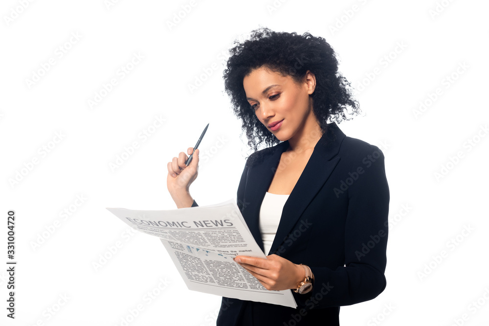 Concentrated african american businesswoman with pen and newspaper isolated on white Concentrated african american businesswoman with pen and newspaper isolated on white