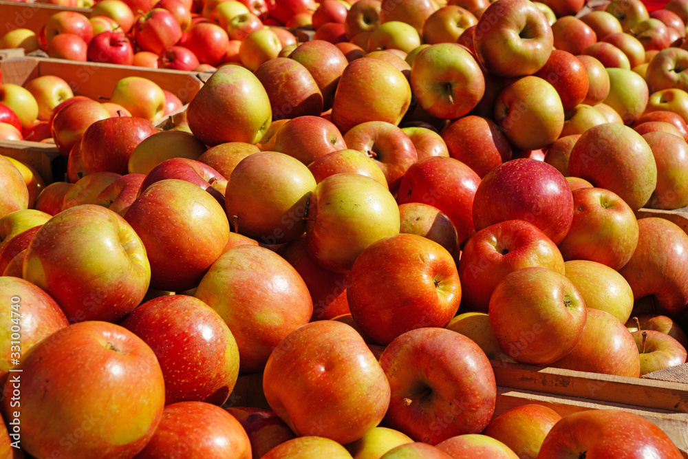 Fresh red and yellow apples at a farmers market