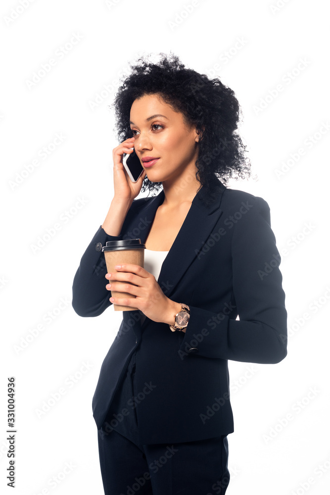 African american businesswoman talking on smartphone and holding disposable cup of coffee isolated on white African american businesswoman talking on smartphone and holding disposable cup of coffee isolated on white