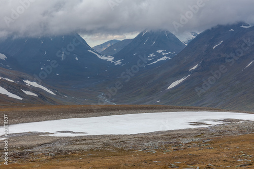 View of the valley. Northern Sweden  Sarek National Park in stormy weather. selective focus