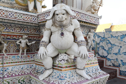 Detail, statue of Wat Pariwat (Beckham's temple) in Bangkok city, Thailand. Religious traditional national Thai architecture. Landmark, sight, architectural monument of Bangkok, Thailand. Asian temple photo