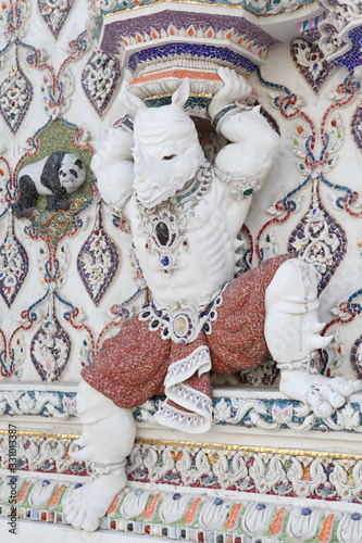 Detail, statue of Wat Pariwat (Beckham's temple) in Bangkok city, Thailand. Religious traditional national Thai architecture. Landmark, sight, architectural monument of Bangkok, Thailand. Asian temple photo