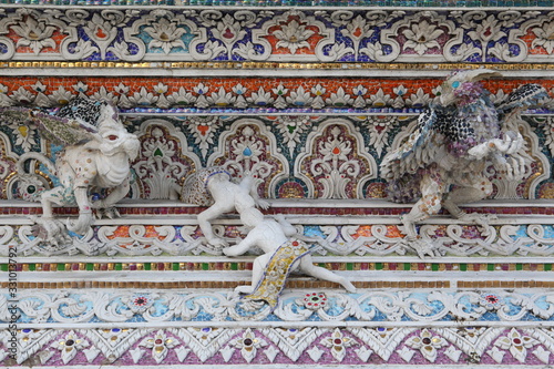 Detail, statue of Wat Pariwat (Beckham's temple) in Bangkok city, Thailand. Religious traditional national Thai architecture. Landmark, sight, architectural monument of Bangkok, Thailand. Asian temple photo