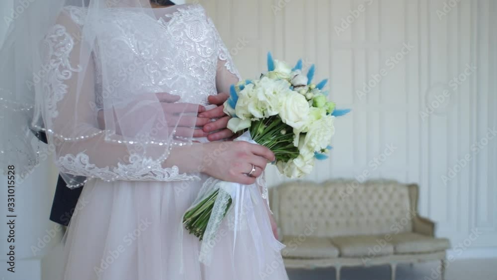 bride and groom together at a wedding in a room bride and groom together at a wedding in a room