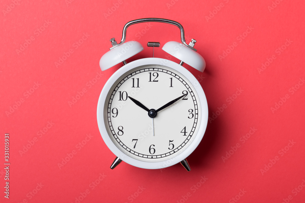 Closeup Alarm Clock For Decorate Show A Quarter To Seven Pm Or 645 Am On  White Wood Desk And Cream Wallpaper Textured Background In Black And White  Tone With Copy Space Stock