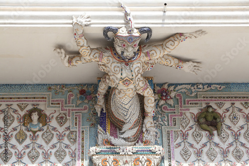 Detail, statue of Wat Pariwat (Beckham's temple) in Bangkok city, Thailand. Religious traditional national Thai architecture. Landmark, sight, architectural monument of Bangkok, Thailand. Asian temple photo