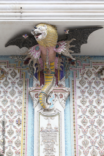 Detail, statue of Wat Pariwat (Beckham's temple) in Bangkok city, Thailand. Religious traditional national Thai architecture. Landmark, sight, architectural monument of Bangkok, Thailand. Asian temple photo