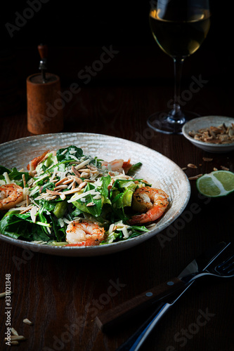 Vegetable salad with grilled shrimps on a plate