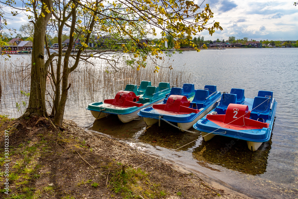 Kayaks on the beach of Galve lake. Trakai, Lithuania – 2019, May