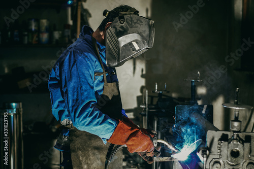 Material processing in the workshop. Hot welding of steel © Zoran