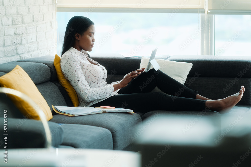 Black Woman Working From Home With Laptop Computer