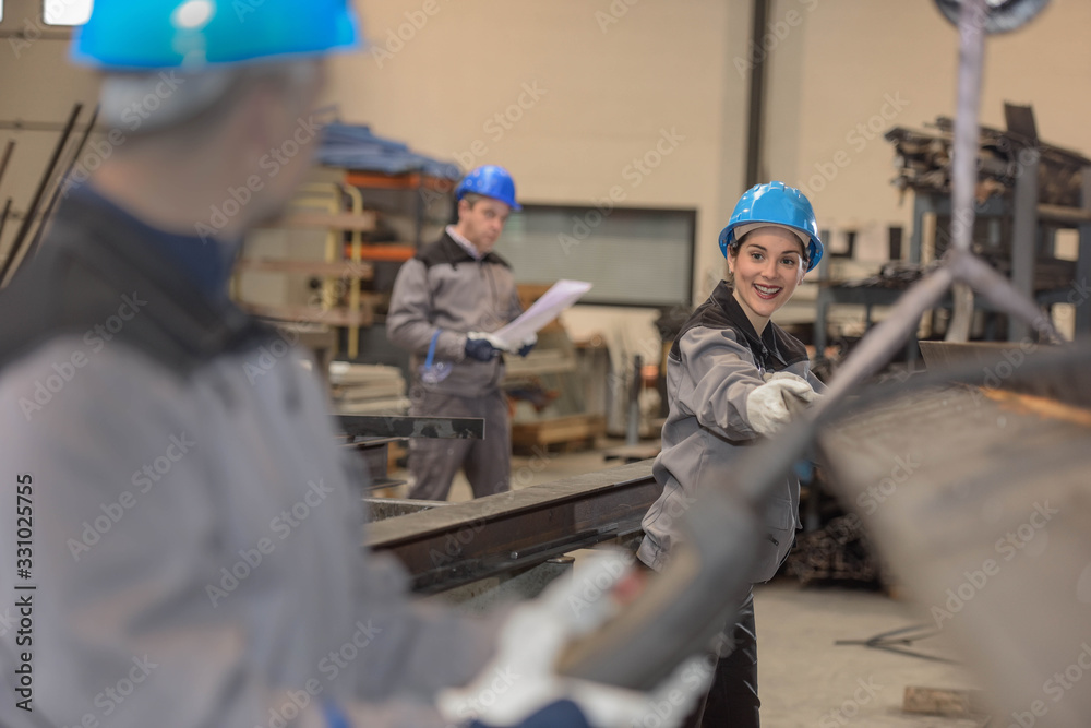 female worker in a metal factory female worker in a metal factory