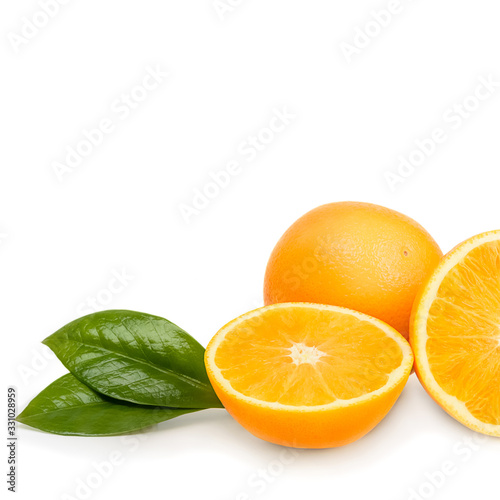 Orange whole and cut into halves with leaves. Isolated on a white background.