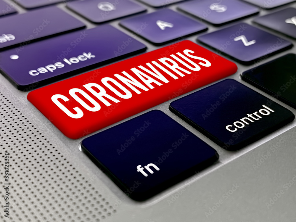 Fototapeta premium Coronavirus key on a laptop