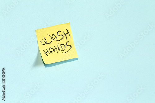 Wash hands post it note against Coronavirus 