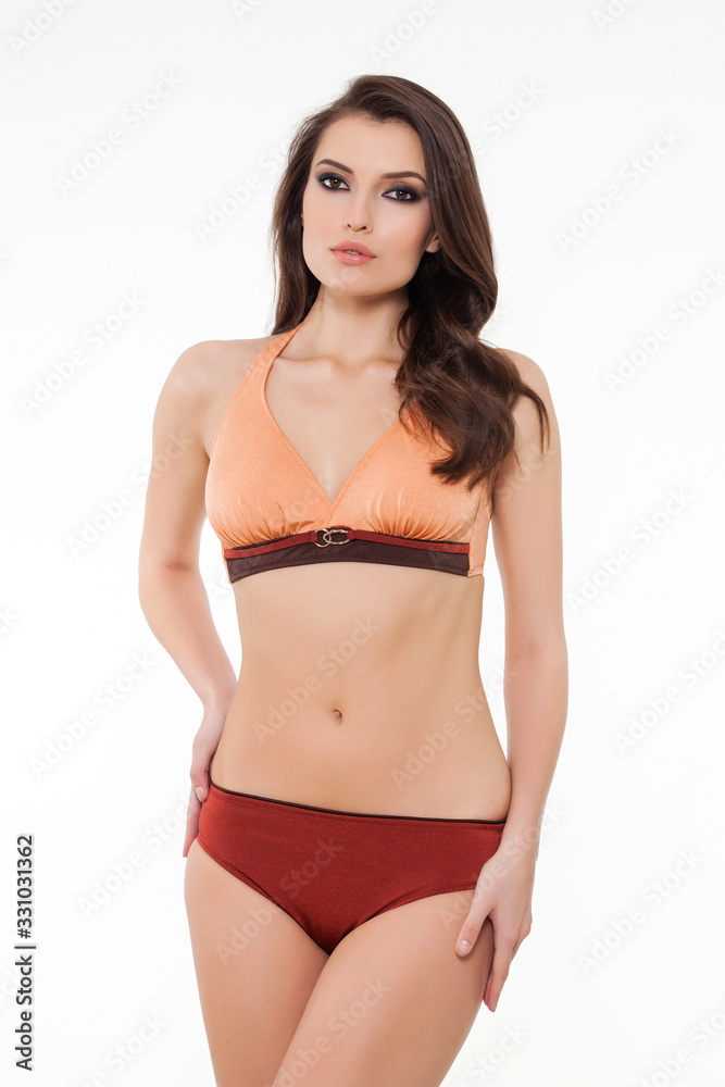 beautiful girl posing in stylish designed chic bikini on white background. beautiful girl posing in stylish designed chic bikini on white background.
