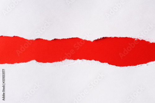 White paper with torn edges isolated with a bright red color paper background inside. Good paper texture.People in protests after the 2020 presidential elections in Belarus, the flag of Belarus.