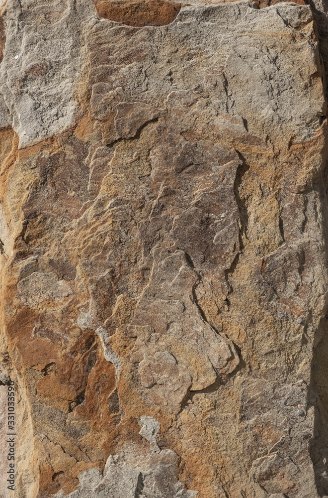 Rough surface of a old granite boulder. Abstract pattern of raw granite. Stone texture for background use. Rough surface of a old granite boulder. Abstract pattern of raw granite. Stone texture for background use.