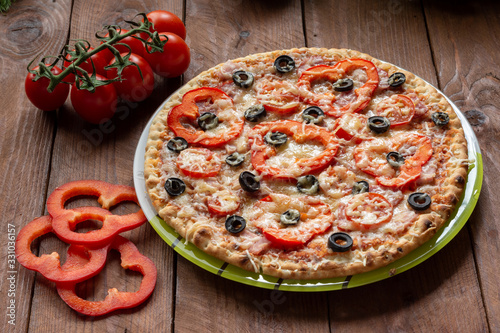 Pizza with olives, tomatoes, ham. Still-life. Assorted pizza #331036157