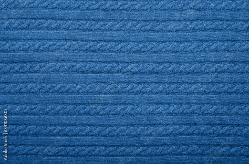 Background texture of blue knitted wool fabric