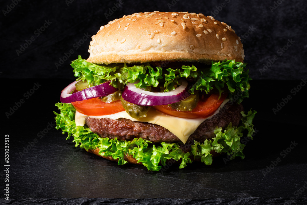 fresh tasty beef burger on dark background fresh tasty beef burger on dark background