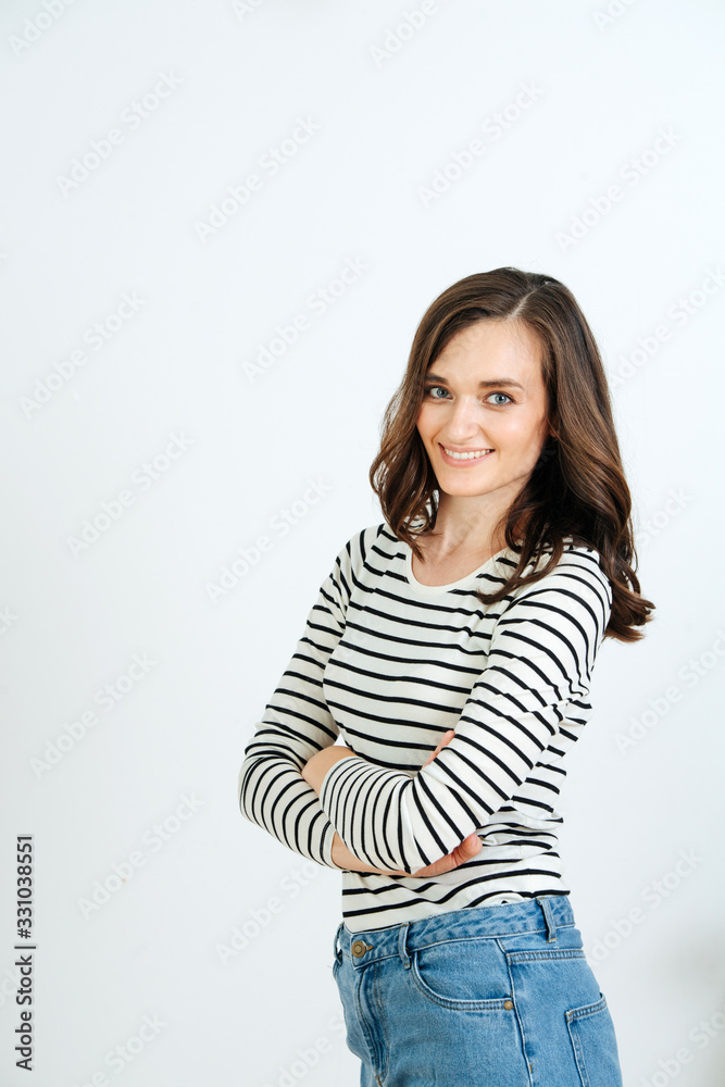 Portrait of a pleasant young girl, she in a striped jacket and jeans Portrait of a pleasant young girl, she in a striped jacket and jeans