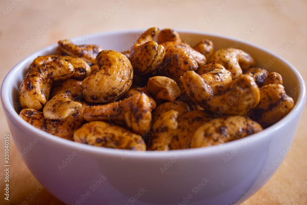 Roasted cashew nuts with salt and black pepper mix. Roasted cashew nuts with salt and black pepper mix.