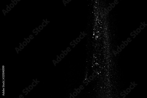 Started splash of white flour powder on black background