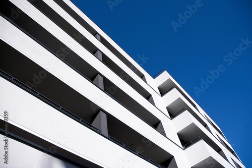 Modern apartment buildings on a sunny day with a blue sky. Facade of a modern apartment building