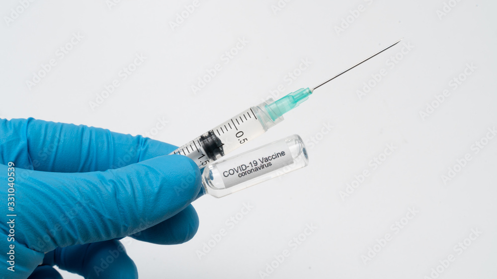 Doctor holds COVID 19 Coronavirus vaccine in his hand, infected blood sample in the sample tube, Vaccine and syringe injection It use for prevention, immunization and treatment from COVID-19 Doctor holds COVID 19 Coronavirus vaccine in his hand, infected blood sample in the sample tube, Vaccine and syringe injection It use for prevention, immunization and treatment from COVID-19
