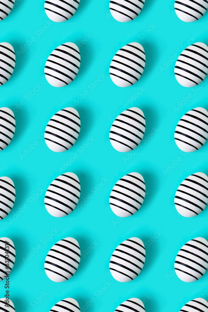 Pattern made of hand drawn eggs on blue pastel background. Easter concept.