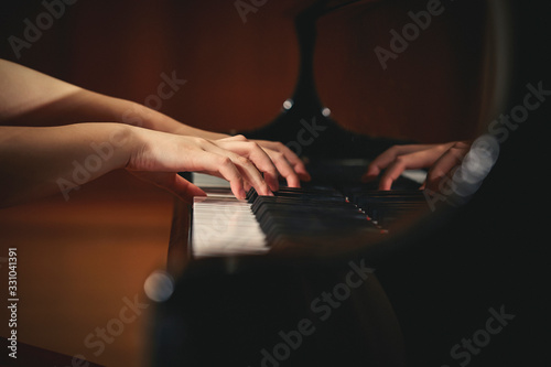 A woman playing the piano