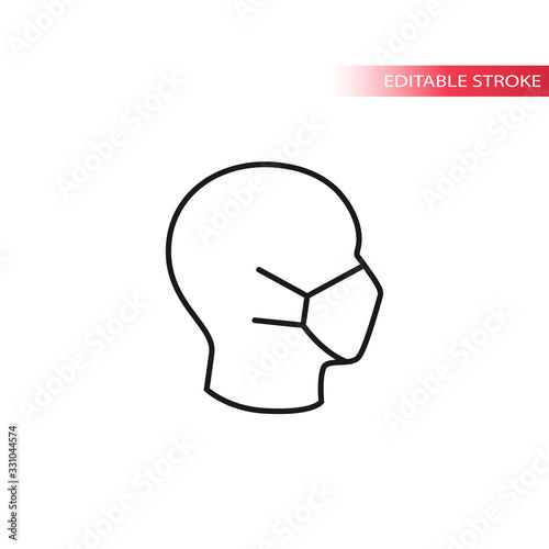Medical mask on human head profile thin line vector icon. Editable stroke.