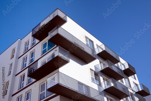 Modern apartment buildings on a sunny day with a blue sky. Facade of a modern apartment building