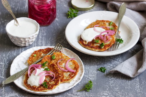 Breakfast made from traditional boxty fritters or latkes served with pickled onions and sour cream.
