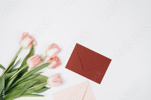 Fototapeta Naklejka Na Ścianę i Meble -  Envelopes, gifts and tulips on white background