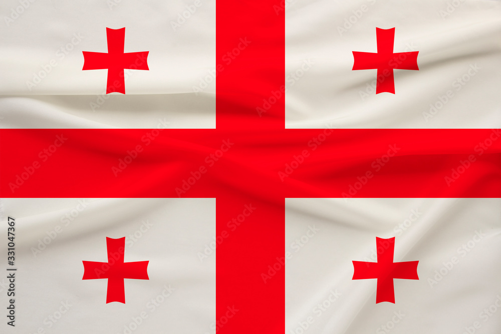 national flag of the country of Georgia on the gentle silk with folds from the wind, the concept of travel, immigration, politics national flag of the country of Georgia on the gentle silk with folds from the wind, the concept of travel, immigration, politics