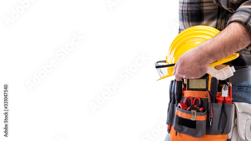 Electrician with tool belt on a white background. Electricity.