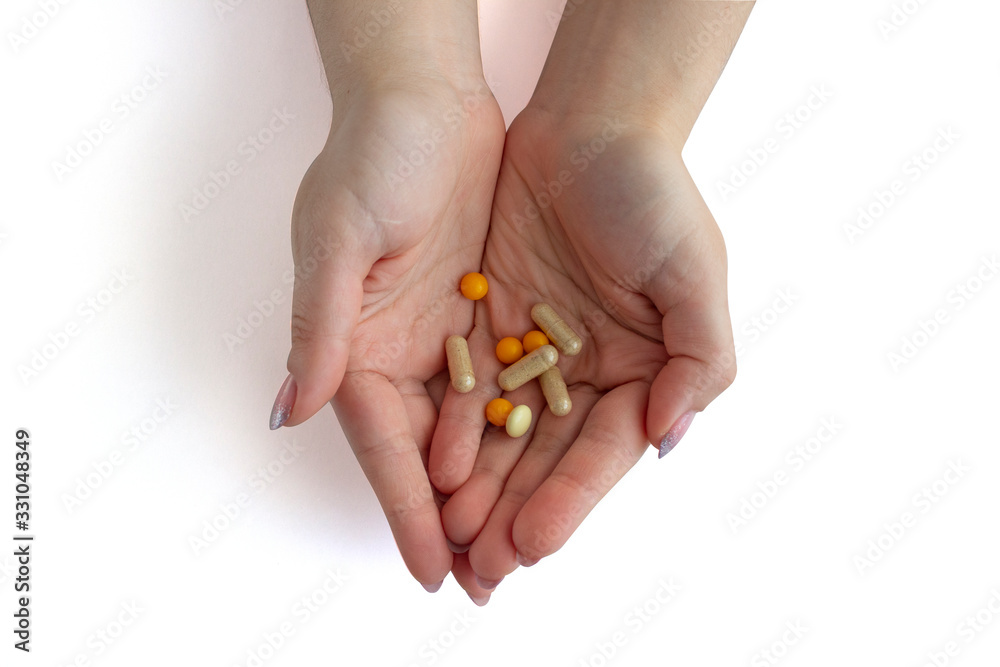 Hands with pills on white background. Hands with pills on white background.