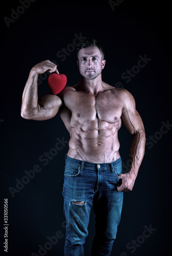 Keep your heart healthy this Valentines day. Strong athlete hold valentines heart. Valentines Day workout. Cupid in training. Gym lover. Love symbol. February 14. Have hearty Valentines day © be free