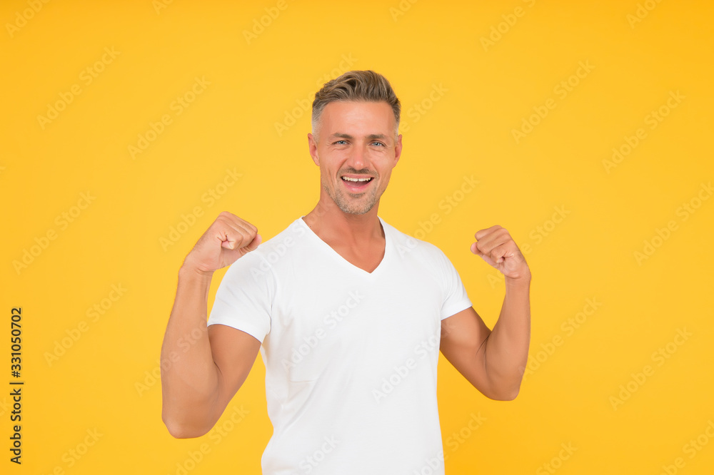 Strength and power. Happy bachelor show strength. Strong man flex arms yellow background. Strength and confident. Strength comes from within Strength and power. Happy bachelor show strength. Strong man flex arms yellow background. Strength and confident. Strength comes from within