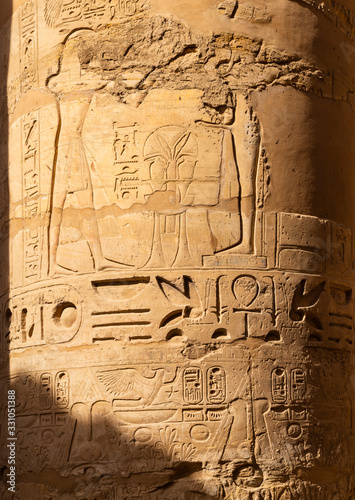 Luxor Governorate, Egypt, Karnak Temple, complex of Amun-Re. Embossed hieroglyphics on columns and walls. Min is an ancient Egyptian god.