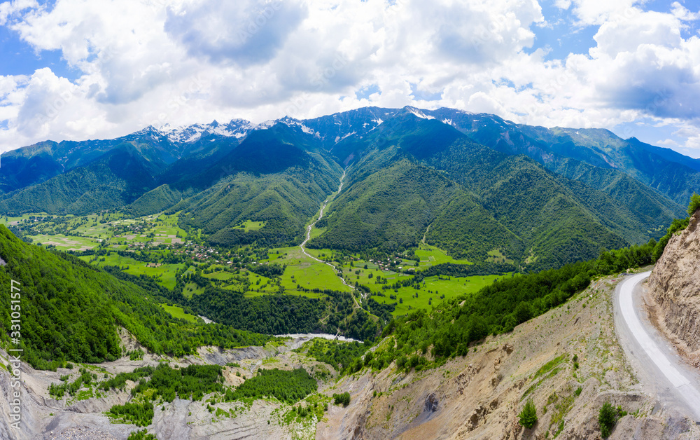 Amazing view of the landslide on a mountain road. The road from Mestia to Zugdidi was blocked by an rockfall. Road services are clearing the mountain road serpentine