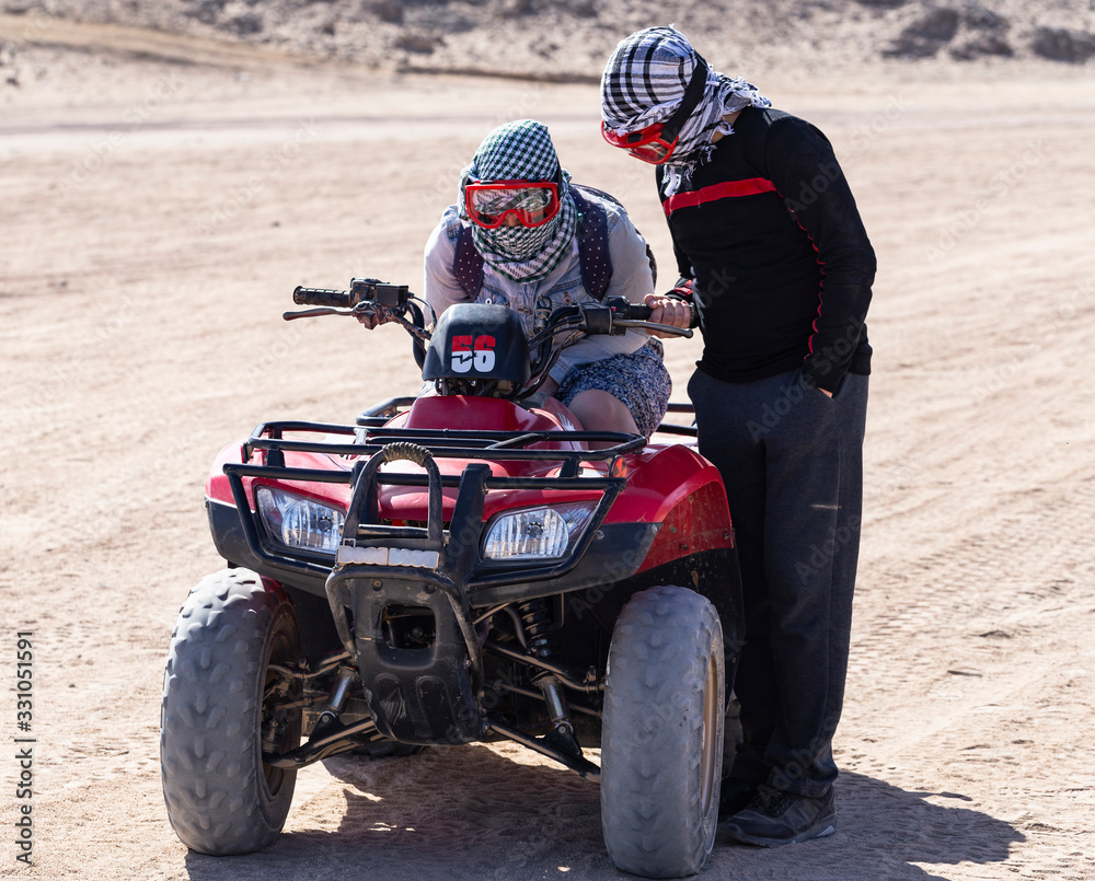 Tours of the desert on Quad bikes. ATV safaris. A vehicle for racing in the Sahara.