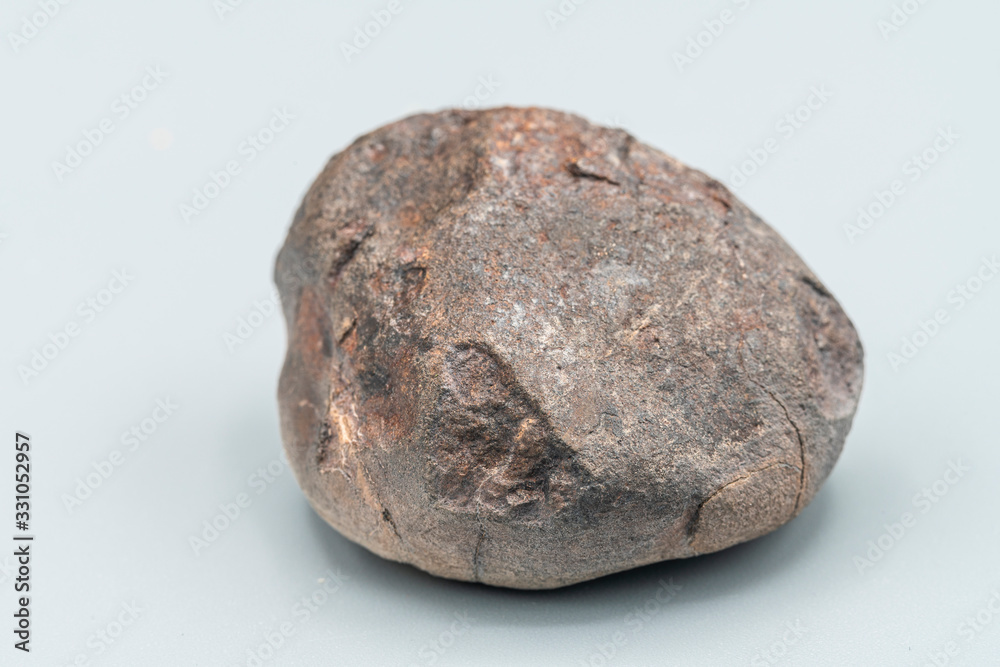 Obraz premium Chondrite Meteorite L6W2 Type isolated, piece of rock formed as an asteroid in the universe at during Solar System creation. The meteorite comes from an asteroid fall impacting Earth at Atacama Desert