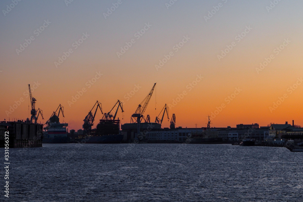 view of the cargo port with floating cranes